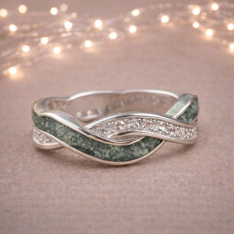 cremation ashes ring in art deco design with ashes visable.