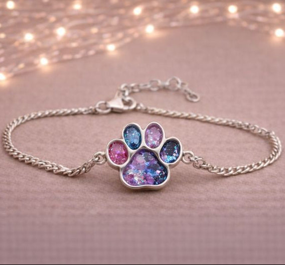 pretty pawprint memorial bracelt with pet ashes inside mixed with crushed opals.